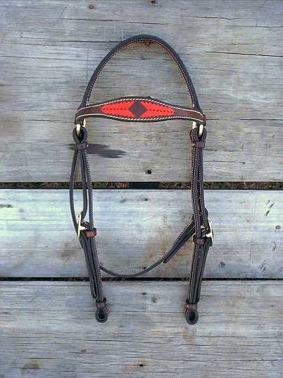Feb12_01-1.jpg - Stock Bridle with Scallop Brow. Dark Brown Leather with Red Applique' in brow.
Brass hardware. 