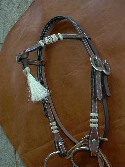 Jan17_03-1.jpg - Dark Tan Cross Brow with Braided Rawhide Knots & Horse Hair tassels. 
Stainless Cart buckles.