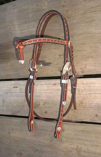 Mar01_07-1.jpg - Custom ~ Cross Brow in Saddle Tan ~ Black edge.
Silver studs , Silver buckles,keepers & tips , Silver Concho's & Silver screws @ bit end.