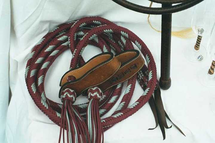 008_5A-1.jpg - Silver and maroon 16 plait reins with slobber straps