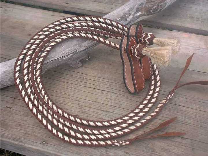 Sep26$01-1.jpg - 12 plait parachute cord split reins brown and beigewith slobber straps.