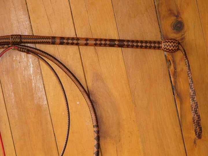 P1140904-1.jpg - 24 plait 8ft 2 toned kangaroo hide bullwhip this pictur shows the detail in the 13 inch handle section.