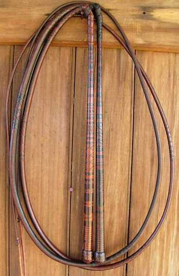 2xstockwhips-1.jpg - Both the whips pictured are 24 x 24 plait 6ft 6in .the lighter coloured whip is 1st place entry at the "Australian Plaiting Championships" 2003. The other is 2nd placed entry for the "Australian Plaiting Championships" 2002.